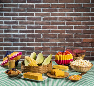 Close-up of cupcakes on table against wall