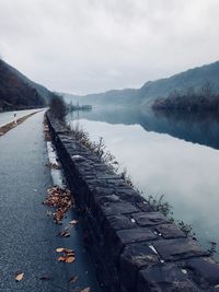 Scenic view of lake against sky during winter