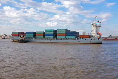 Containership on the yangon river near yangon in myanmar