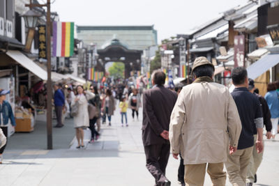 People walking on street in city