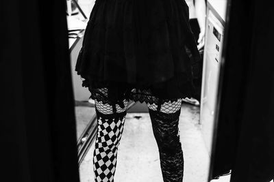 Low section of woman standing on floor