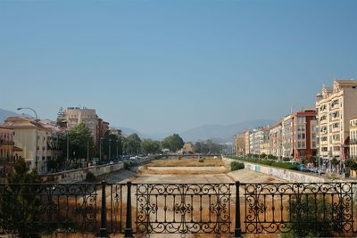 Buildings against clear blue sky