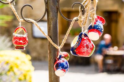 Close-up of multi colored decoration hanging outdoors