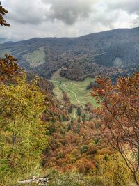 High angle view of trees and mountains against sky