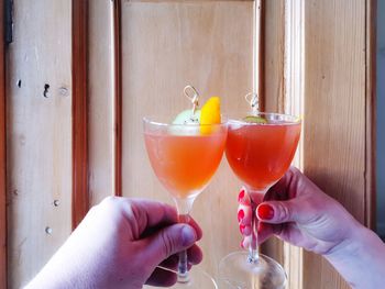 Midsection of woman holding drink