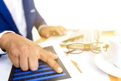 Close-up of man working on table