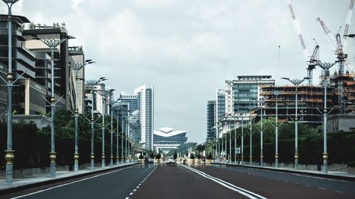 Street amidst buildings against sky