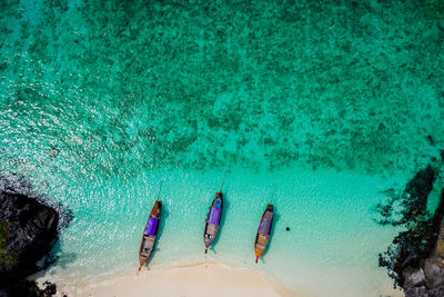 High angle view of long trail boat and tourist on the beach kra bi thailand 