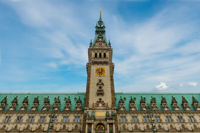 Low angle view of clock tower against sky