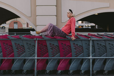 Midsection of woman with red umbrella