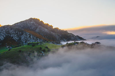 Scenic view of mountain against sky during sunset