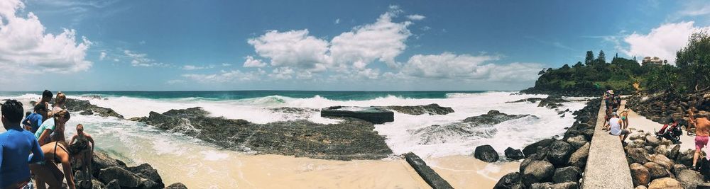 Scenic view of sea against cloudy sky