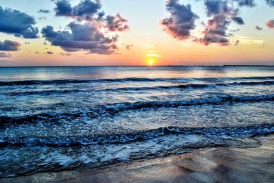 Scenic view of sea against sky during sunset