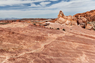 Rock formations on landscape against sky