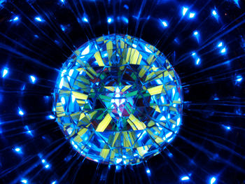 Low angle view of illuminated lights hanging from ceiling