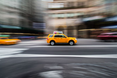 Blurred motion of car on city at night