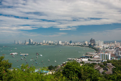 High angle view of bay and buildings against sky