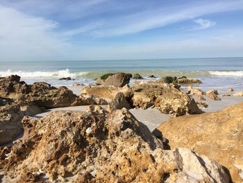 Scenic view of sea against cloudy sky