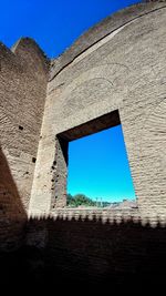 Low angle view of blue sky seen through window