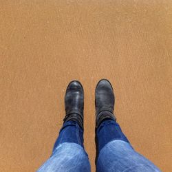 Low section of woman standing on tiled floor