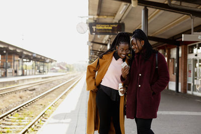People standing on railroad station platform