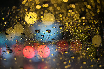 Close-up of raindrops on glass window