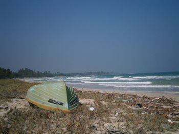 Scenic view of beach against clear sky