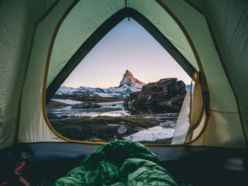 High angle view of tent on rock against sky