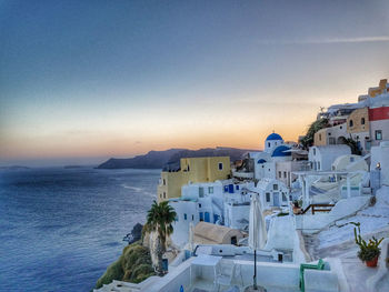 High angle view of buildings by sea