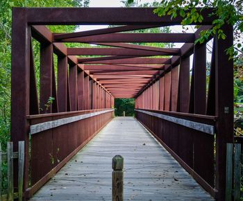 View of footbridge along plants