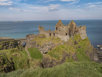 Scenic view of sea and buildings against sky