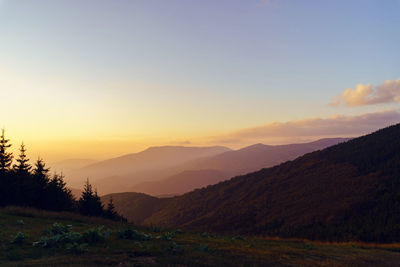 Scenic view of mountains against sky during sunset