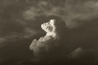 Low angle view of smoke stack against sky