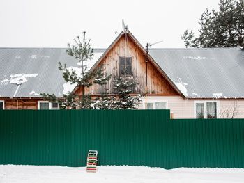 Building against sky during winter