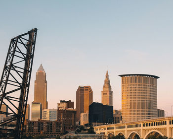 Modern buildings in city against clear sky