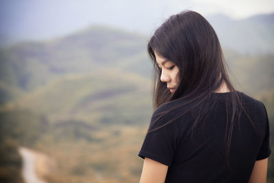 Young woman standing in mountains