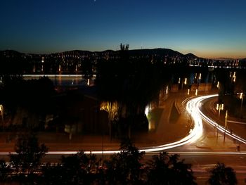 High angle view of light trails on road at night