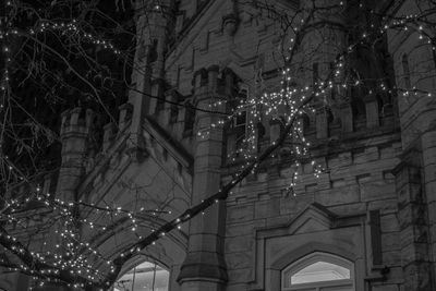 Low angle view of illuminated building at night