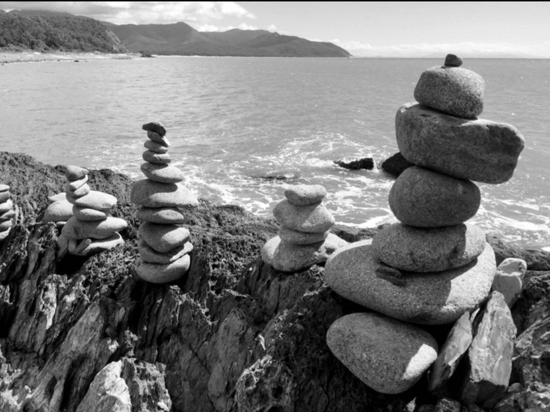 black and white, rock, water, sea, monochrome photography, nature, balance, beach, stone, monochrome, tranquility, day, land, zen-like, pebble, tranquil scene, beauty in nature, no people, scenics - nature, coast, large group of objects, outdoors, sky, arrangement