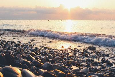 Scenic view of sea at sunset