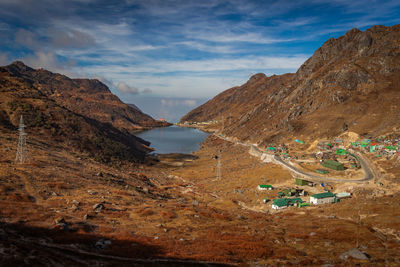 Himalayan breathtaking landscape with bright blue sky and twisty adventurous valley road