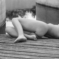 Woman lying on board into pool