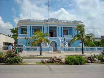 Exterior of building by trees against sky