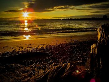 Scenic view of sea at sunset