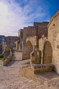 View of old building against cloudy sky