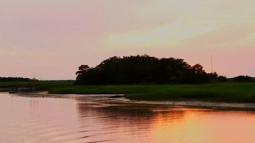 Scenic view of sea at sunset