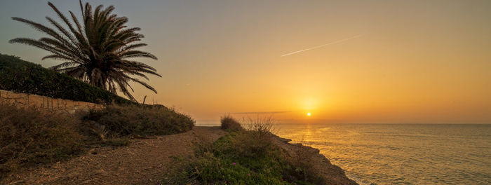 Scenic view of sea against sky during sunset