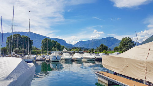 Panoramic view of swimming pool by lake against sky