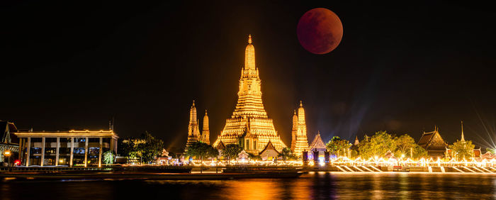 Lunar eclipse, super red full moon taken from top side of  wat arun temple in bangkok thailand.