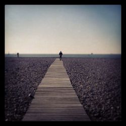 Pier on sea against sky